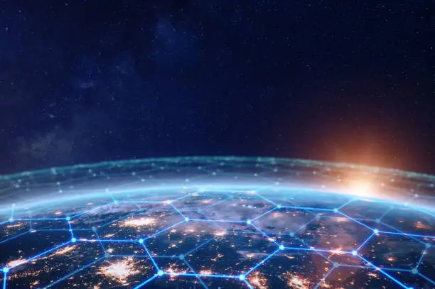 Communication network above Earth for global business and finance digital exchange. Internet of things (IoT), blockchain, smart connected cities, futuristic technology concept. Satellite view.