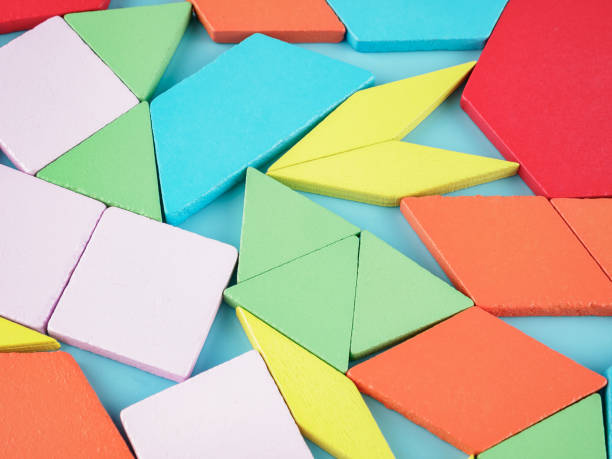 istock Wooden constructor made of multi-colored blocks of different shapes and structures, a puzzle toy 1358840510