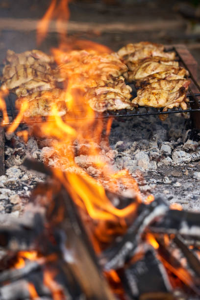 istock Chicken thighs on the grill 1358841186