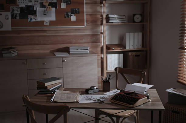 istock Detective's office interior with wooden desk and evidence board 1358843266