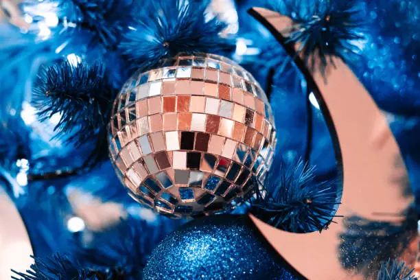 Photo of Blue and silver christmas balls on blue christmas tree