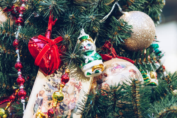 istock Multicolored Christmas tree toys on the New Year tree close-up 1358843295