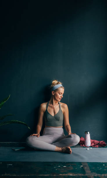 istock Smiling Woman Taking a Break at Yoga Studio 1358843440