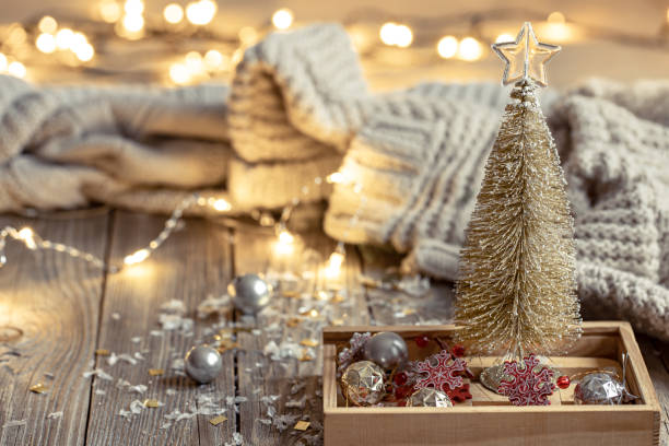istock Cozy Christmas background with decorative Christmas tree and bokeh lights. 1358844303