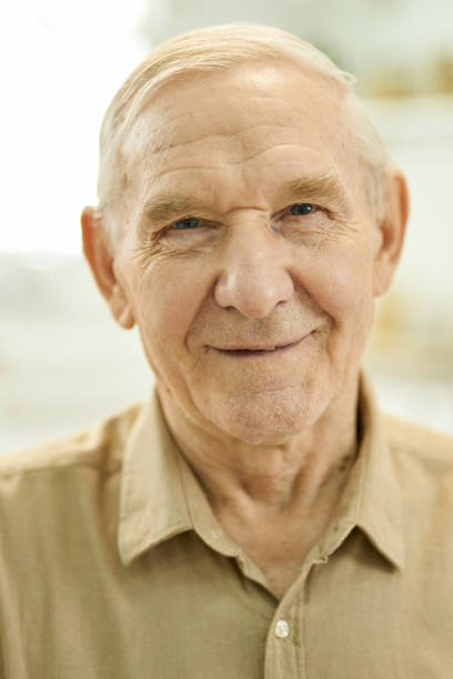 istock Joyful grandpa posing for the camera and looking optimistic 1358844720