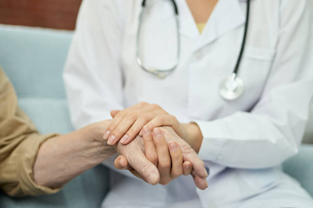 istock Caring nurse supporting the male patient during treatment 1358844761