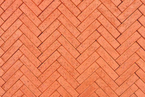 istock Redbrick paving stones on a sidewalk or pavement. Top view 1358844790