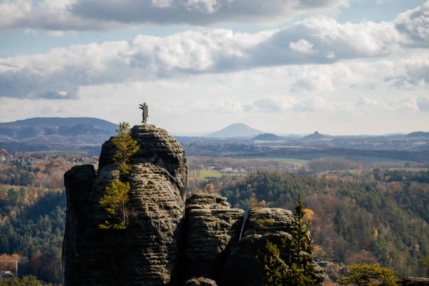 istock Basteiaussicht or Bastei Rock Formations in Elbe River Valley, Sandstone Mountains Path, autumn forest landscape at sunny day, rocky valley 1358847254