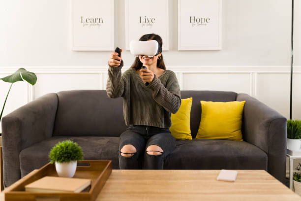 istock Cheerful woman playing with the latest technology 1358850689