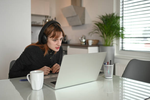 istock Young woman at home talking during a video call 1358851906