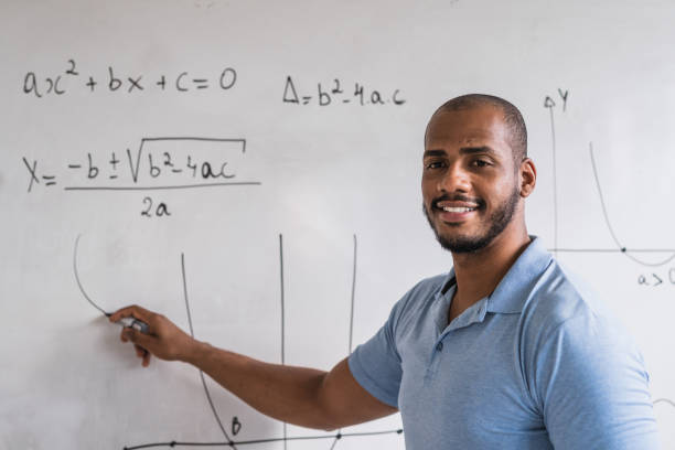 istock Mathematics teacher giving an example of the activity to the student 1358852912