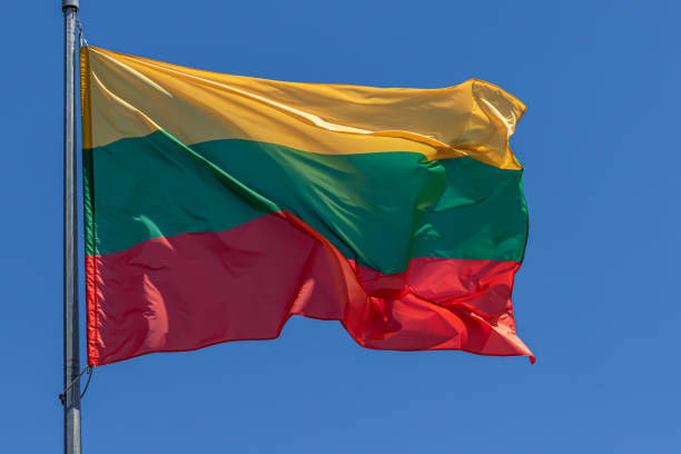 Lithuanian national flag. Republic of Lithuania. LT Lithuanian national flag waving on blue sky background. Republic of Lithuania, LT coalition photos stock pictures, royalty-free photos & images
