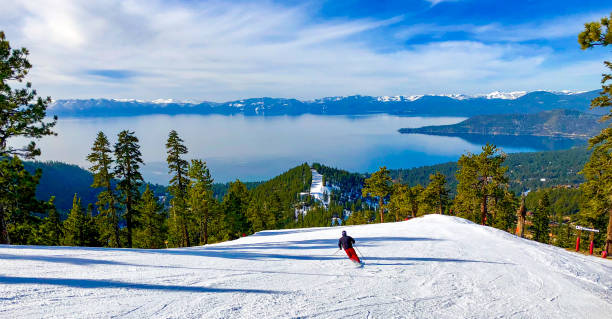 Alpine skiing above Lake Tahoe on the Nevada California border, USA Downhill skiing with Lake Tahoe in the background skiing stock pictures, royalty-free photos & images