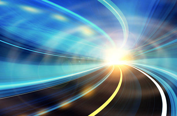 Graphic of long-exposure roadway travel toward light stock photo