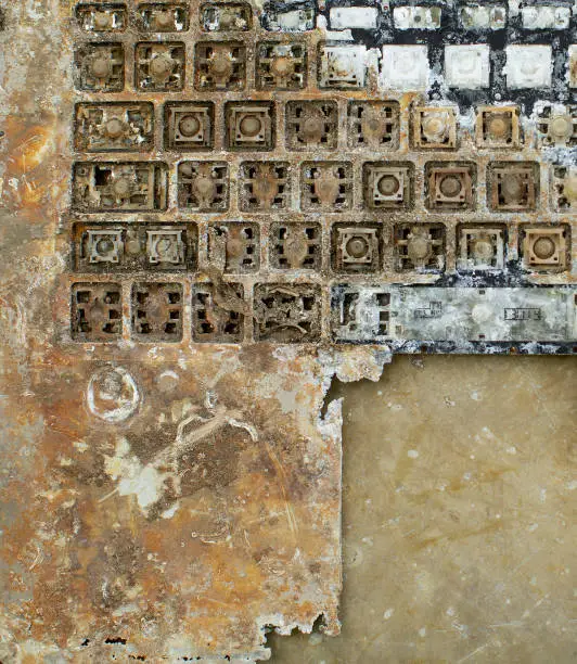Close up detail of destroyed and corroded vandalised laptop computer keyboard with cover removed and dumped