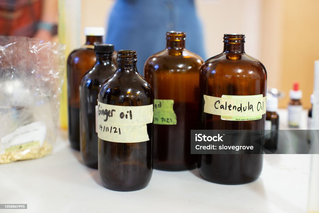 Ingredients being used to make homemade remedial skin care salves and lotions View of ingredients being used to make homemade remedial skin care salves and lotions Alternative Medicine Stock Photo