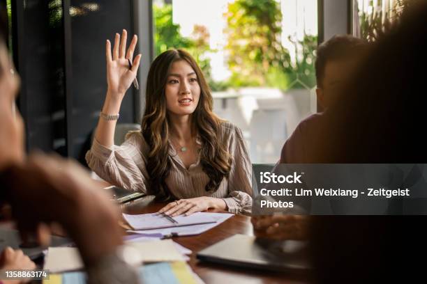 Business Lady Asking A Question During A Discussion Stock Photo - Download Image Now