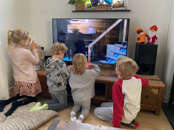 istock Children watching tv on Sinterklaas day 1358863946