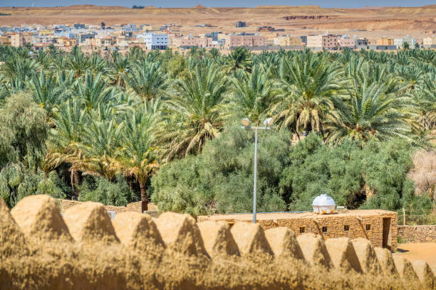 Tenehir, Morocco-September 25, 2013: Panaromic view of the city of Tenehir, built at the foot of the Atlas Mountains. Houses built as casbah appear.
