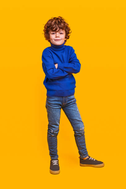 istock Stylish kid in casual clothes looking at camera 1358868226