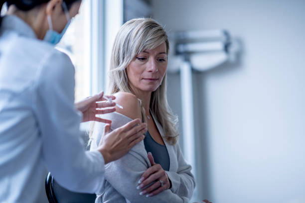 istock Woman Receiving a Vaccination 1358868378