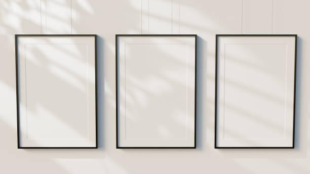 istock 3D Render Black Minimal blank wooden picture frames on white wall background 1358868790