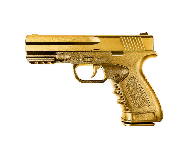 istock gun gold metal isolated on white background 1358869955