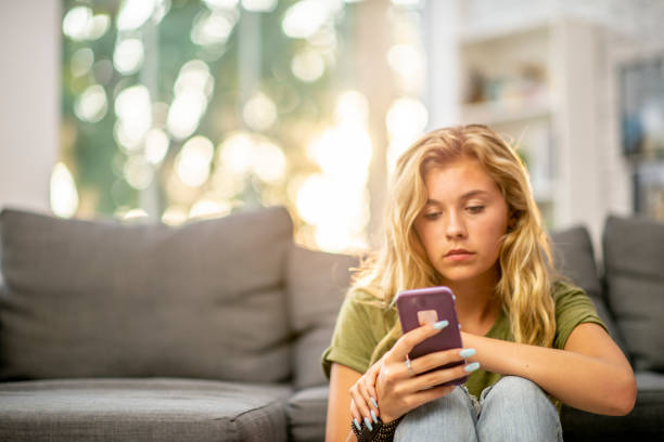 istock Young Girl on Her Cell Phone 1358874588