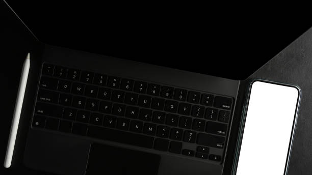 istock a tablet with smartphone blank screen on a desk. 1358875987