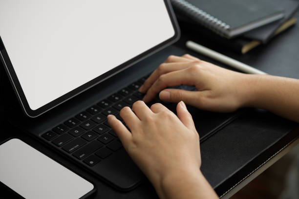 istock Female or businesswoman typing on tablet's keyboard 1358876014