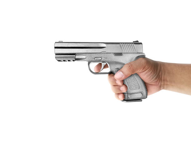 istock A man with gun silver metal isolated on white background 1358881528
