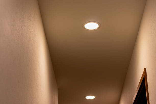 istock Small lights glowing on the ceiling in the hall 1358882527