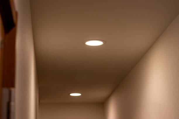 istock Small lights glowing on the ceiling in the hall 1358882531