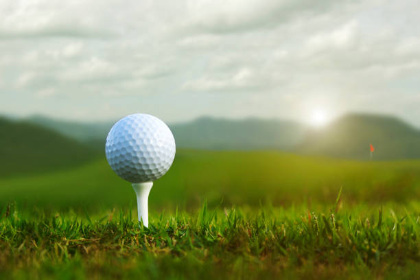 istock golf ball on tee in a beautiful golf course with morning sunshine 1358884029