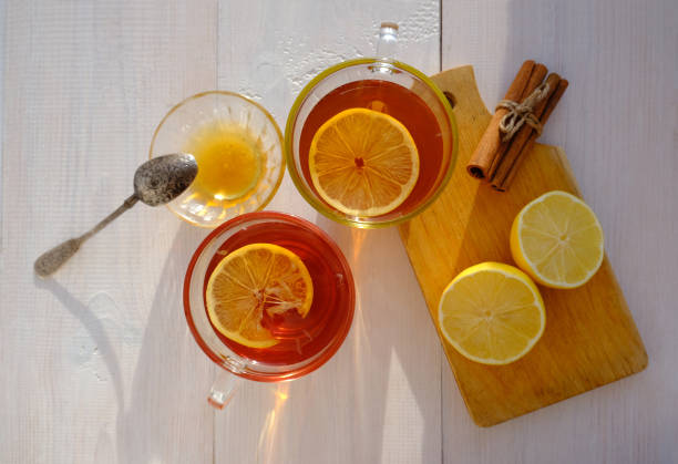 istock tea with lemon, cinnamon and honey, flat lay in warm colors 1358884857