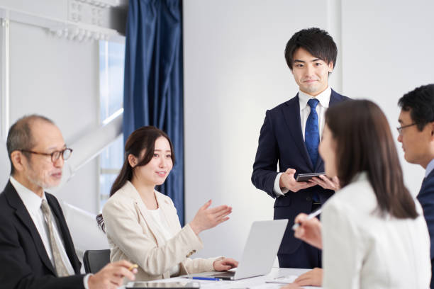 Asian business woman explaining at a meeting