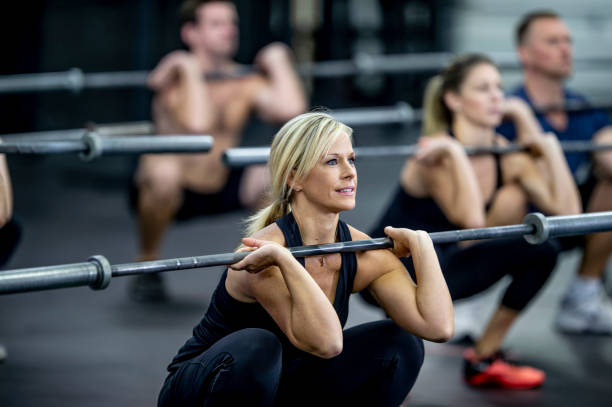 istock Squatting with a Weight Bar 1358886710
