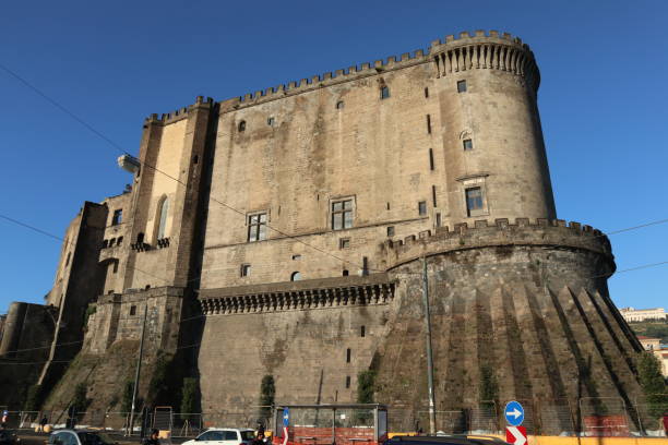 Naples - Maschio Angioino dalla Marina Naples, Campania, Italy - December 7, 2021: Maschio Angioino, castle built in the 13th century by Charles I of Anjou also known as Castel Nuovo, in Piazza Municipio bailey castle stock pictures, royalty-free photos & images
