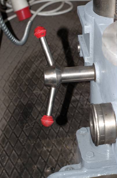 istock Red cap on the handle of the drilling machine control. 1358889820