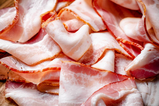 istock Strips of bacon. Macro background 1358892411