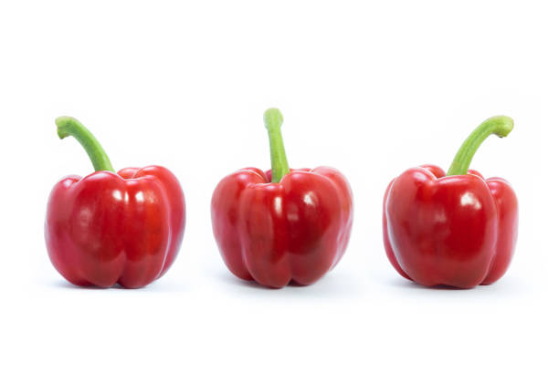 Red bell peppers isolated on white background. Fruits rich in vitamins A, C, antioxidants, anti-inflammatory and reduce blood fat are very good for human health