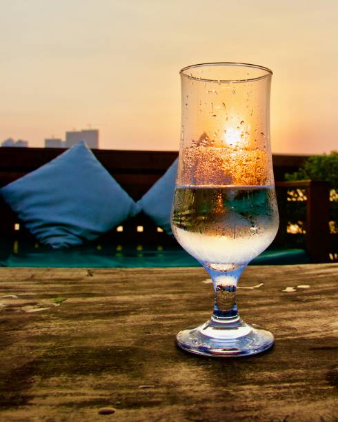 Glass of water in the sunset on a boat
