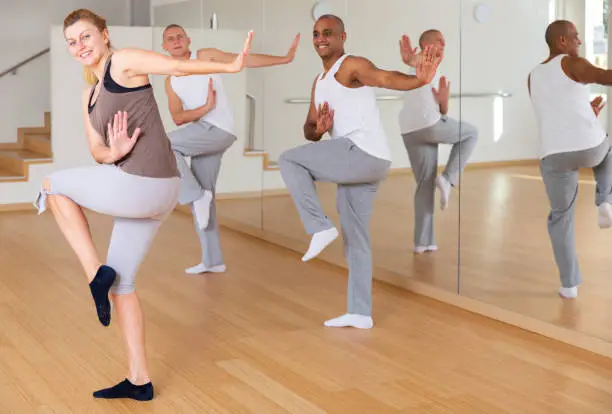 Photo of Woman dancing at group lesson in studio