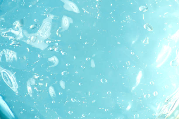 istock Blue liquid gel texture background. Abstract liquid with bubbles. Cosmetic swatch 1358904297