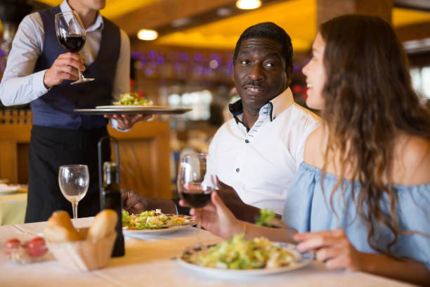 istock American couple celebrating anniversary enjoying dinner 1358906432