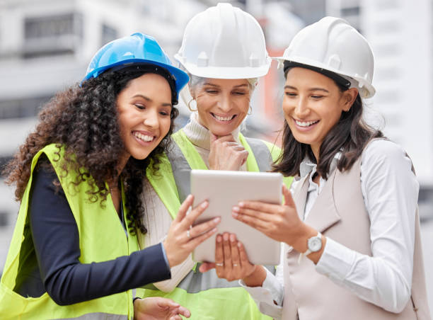 istock Cropped shot of three attractive female engineers using a tablet while working on a construction site 1358906477