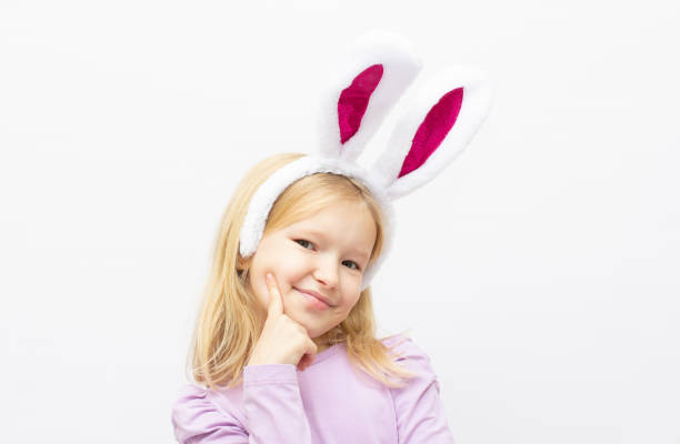istock Cute little girl wearing bunny ears 1358906593