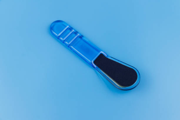 istock Blue pedicure grater on blue background 1358908901