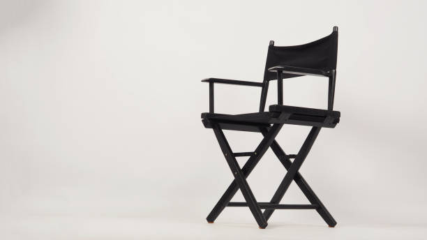 istock Black director chair isolated on white background. 1358911397
