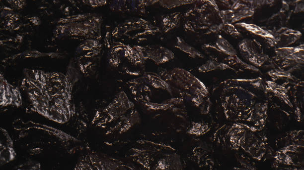 Sweet dried prunes stock photo